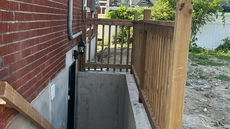Side view of a house and basement entrance