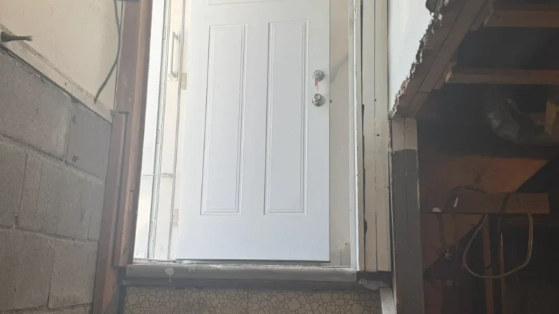 Basement under construction, door and stairs